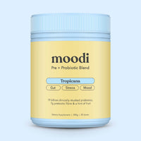 Container of moodi Pre + Probiotic Blend on a light blue background