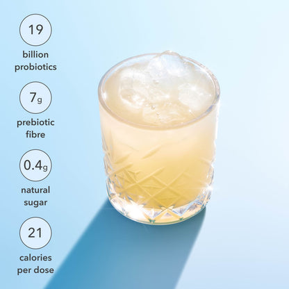 Glass of a probiotic drink with nutritional information on a light blue background