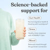 Person holding a glass of Moodi Lemon Lime with text about science-backed support for gut health, stress, and mood.