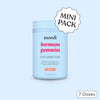 Container of moodi hormone gummies with peach flavor on a light blue background
