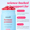 Moodi hormone gummies packaging with text highlighting benefits on a light blue background