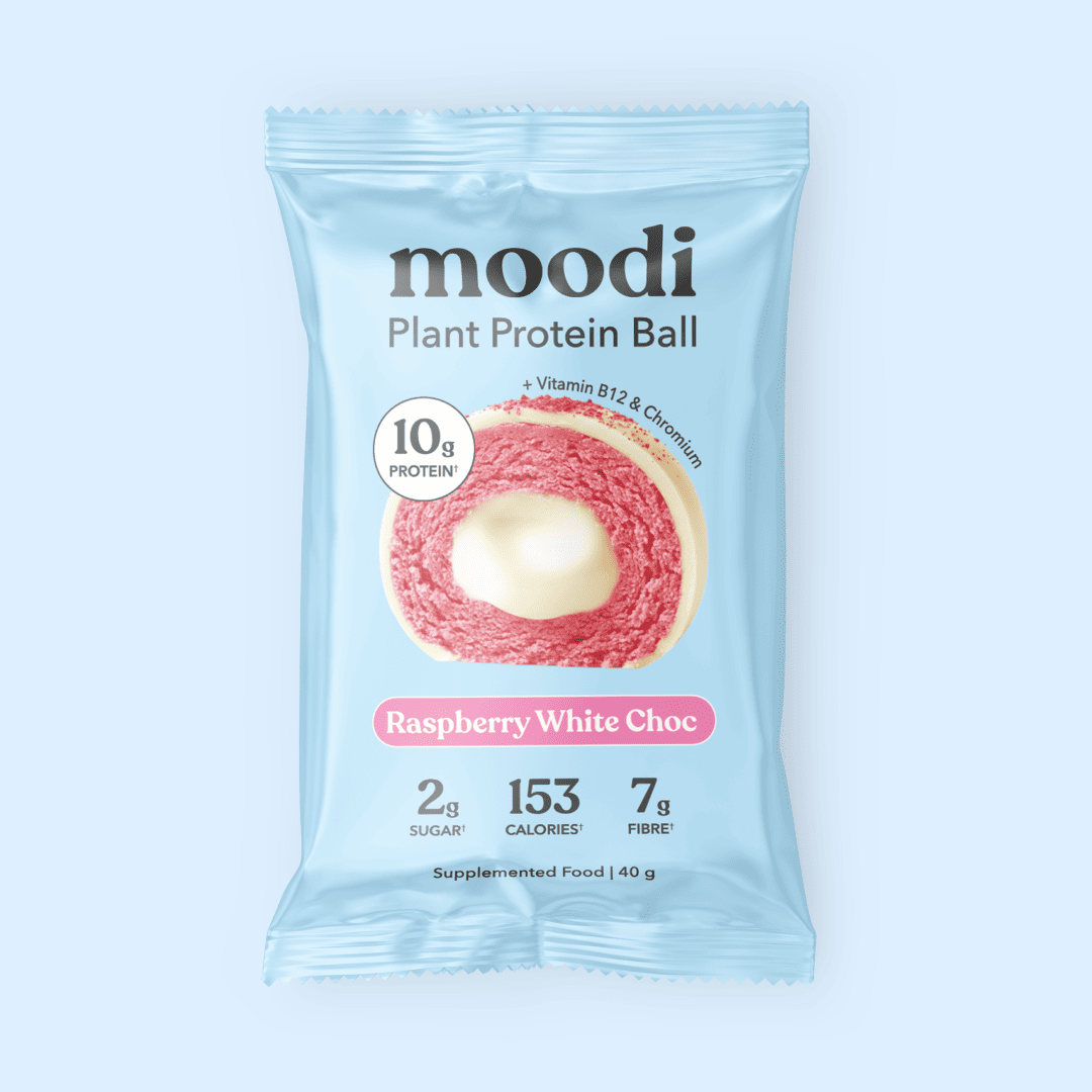 Moodi Raspberry White Choc Plant Protein Ball packaging on a light blue background