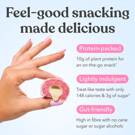Hand holding Moodi Raspberry White Choc plant protein ball with text about its nutritional benefits on a light blue background