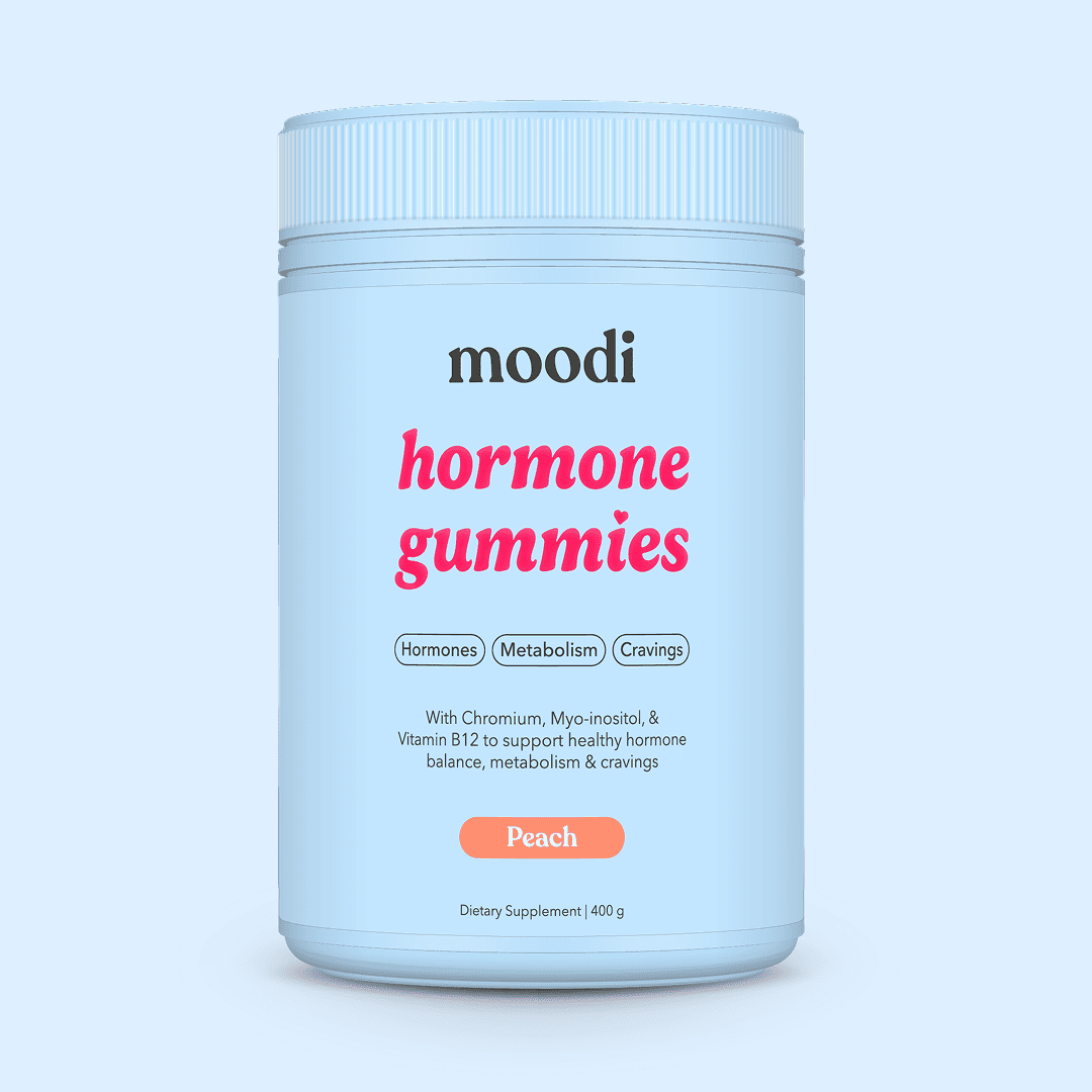 Container of moodi Peach Hormone Gummies on a light blue background