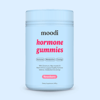 Moodi Strawberry hormone gummies tub on a light blue background