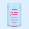 Moodi Strawberry hormone gummies tub on a light blue background