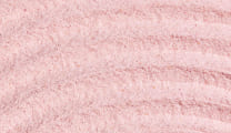 Close up shot of a light pink powder with patterns.