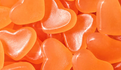 Close-up of orange heart-shaped gummies
