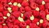 Close-up of raspberries and white chocolate buttons